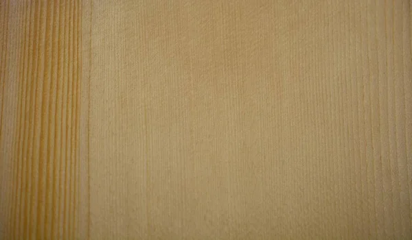 Alaskan Sitka Spruce wood color sample. The softwood color sample can be used as a tileable pattern, color chip, or wood selector chip. The straight grain patter is tight with some orange tones. This type of wood is used in solid top guitar building.