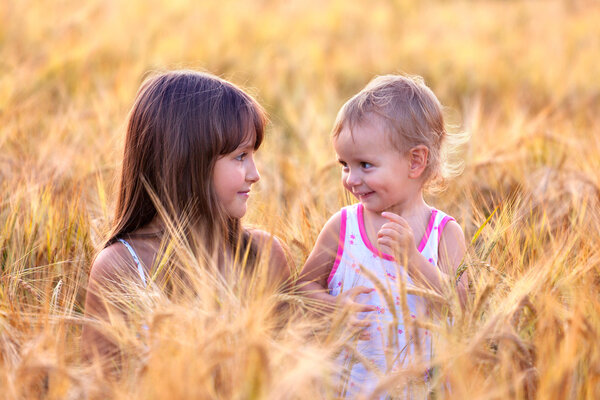 Sisters in the field of wheat