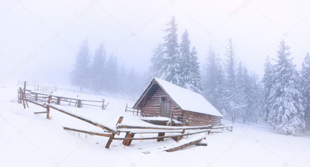 Old farm in the mountains at winter