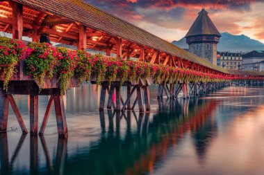charm of ancient cities of Europe. Famous old wooden Chapel Bridge (Kapellbrucke), landmark 1300s wooden bridge, Lucerne cityscape, Switzerland, Europe. clipart
