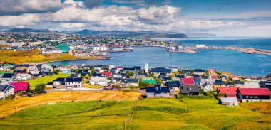 Panoramic summer sityscape of Torshavn town. Colorful morning scene of Streymoy island, Faroe, Denmark, Europe. Traveling concept background. clipart