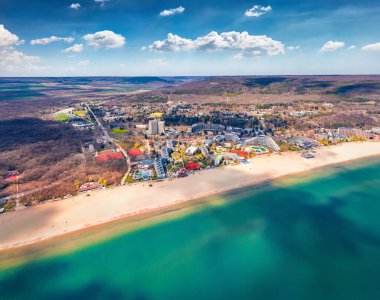 Fantastic aerial view of Albena Beach. Early spring in Bulgaria, Europe. Sunny seascape of Black sea. Traveling concept background clipart