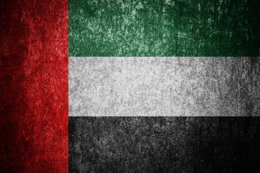 İngiliz Birleşik Arap Emirlikleri bayrağına yakın çekim. Metal bir yüzeyde kirli Birleşik Arap Emirlikleri bayrağı.