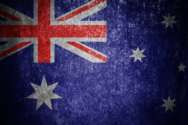 Closeup of grunge Australian flag. Dirty Australia flag on a metal surface.