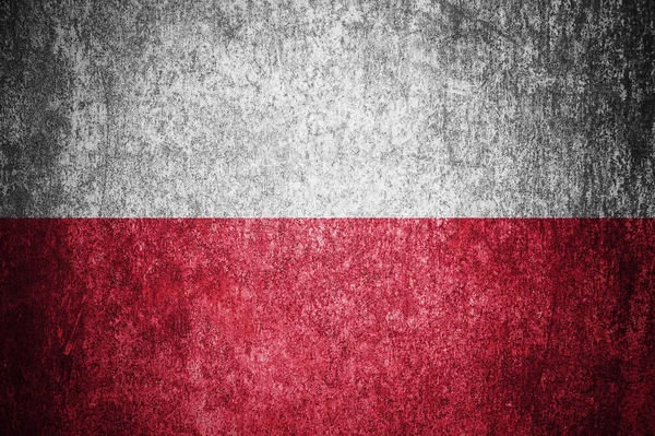 Closeup of grunge Polish flag. Dirty Poland flag on a metal surface.