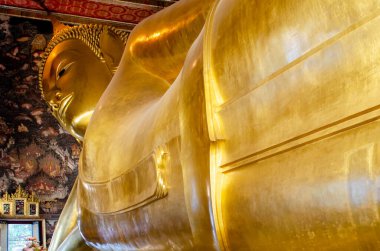 BANGKOK, THAILAND - DECEMBER 10, 2016. Golden reclining Buddha statue in Bangkok temple. Wat Pho temple 