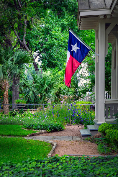 A Texas state flag, or Lonestar flag, hangs proudly at the King William Historic District in San Antonio, Texas.