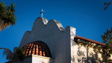 The setting sun warms the back of the Immaculate Conception Church at Old Town in San Diego, California.