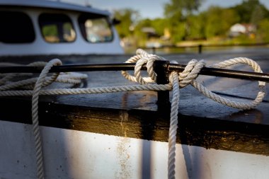 The sun casts shadows on the knot of a moored fishing trawler at a pier in Two Rivers, Wisconsin.