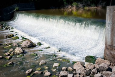 The Manitowoc River flows over the dam near the little town of Clarks Mill near Manitowoc, Wisconsin.