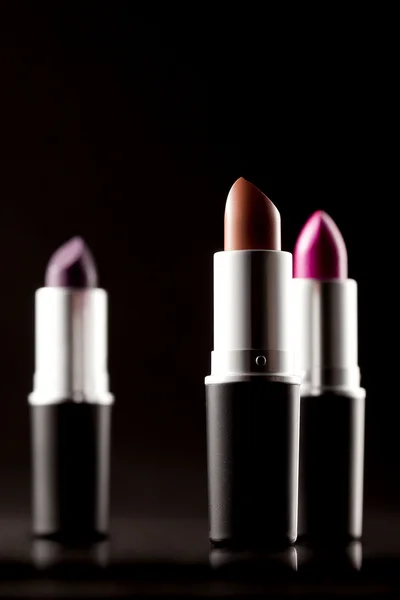 Lipsticks on blacks background — Stock Photo, Image