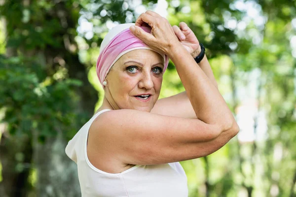 senior woman with cancer in nature