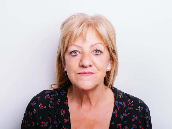 portrait of a senior woman on a white background