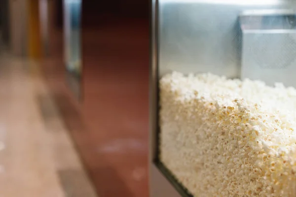 popcorn inside a hurricane at the entrance of the movie cinema