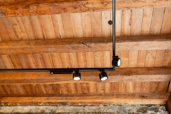 light fixtures in a wooden ceiling