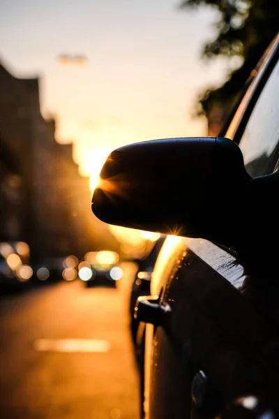 Sunset in the city and car, traffic in the city. Defocused. High quality photo