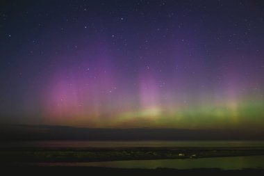 Intense northern lights aurora borealis over beach in Riga, Latvia. Defocused. High quality photo