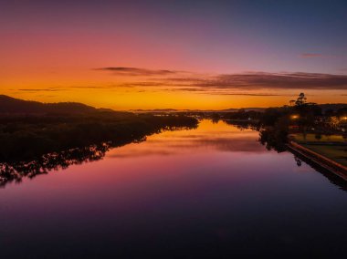 Aerial sunrise over the bay with high cloud at Woy Woy on the Central Coast, NSW, Australia.