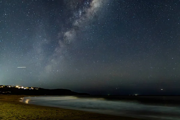 Milky Way and stars in the night sky at Killcare Beach, Central Coast, Australia.