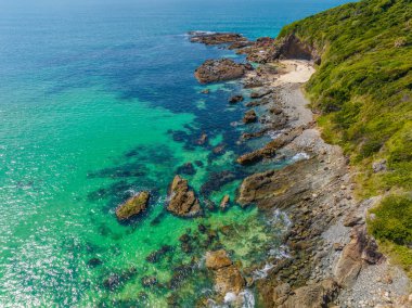 Forster-Tuncurry, NSW, Avustralya 'daki Barrington sahilindeki Burgess Sahili' nde gündüz deniz manzarası.