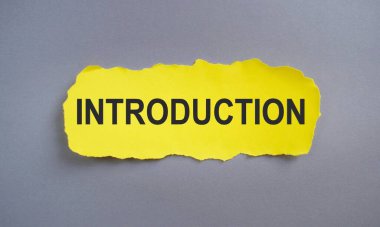 INTRODUCTION, sarı yırtık kağıt üzerinde metin, iş konsepti, Üst görünüm düz yatıyordu.