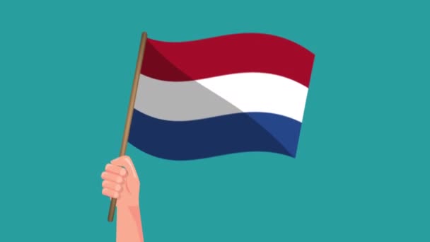 オランダの国旗アニメーションを手に持つ 旗を振って 国民の象徴 4Kビデオ映画アニメーション — ストック動画