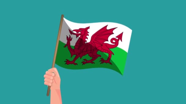 ウェールズの国旗アニメーションを手に持つ 旗を振って 国民の象徴 4Kビデオ映画アニメーション — ストック動画