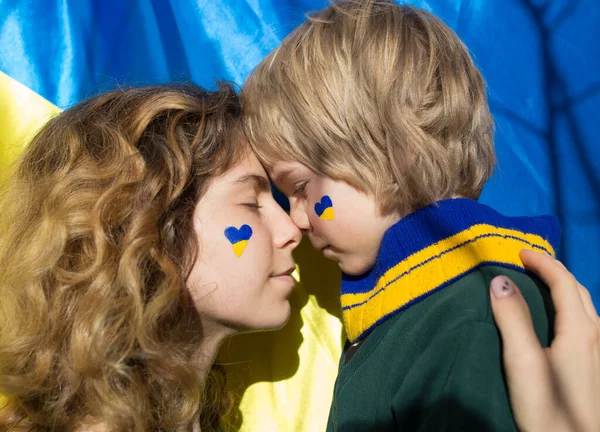 Faces Boy Child Young Woman Painted Yellow Blue Heart Cheeks — Stock Photo, Image