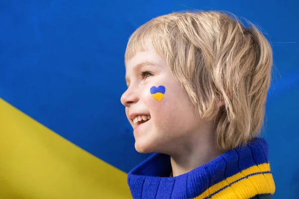 Face Happy Boy Profile Heart Painted His Cheek Yellow Blue — Stock Photo, Image