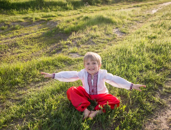 Cute Joyful Barefoot Boy National Ukrainian Clothes Embroidered Shirt Red — стокове фото