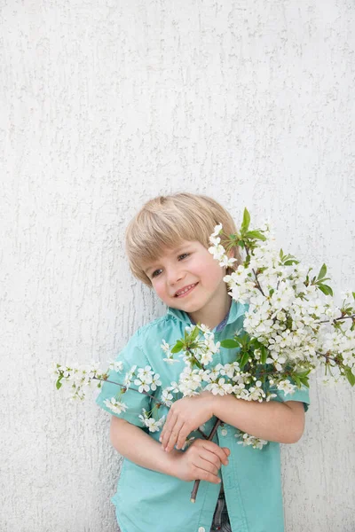 Cute Positive Boy Years Old Turquoise Shirt Holds Bouquet Cherry — стоковое фото