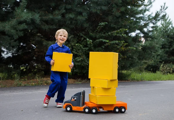 Cute Smiling Boy Years Old Blue Overalls Uniform Stands Big — стоковое фото