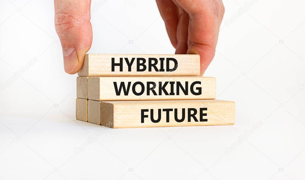 Hybrid working future symbol. Concept words 'hybrid working future'. Businessman hand. Beautiful white background. Business and hybrid working future concept, copy space.