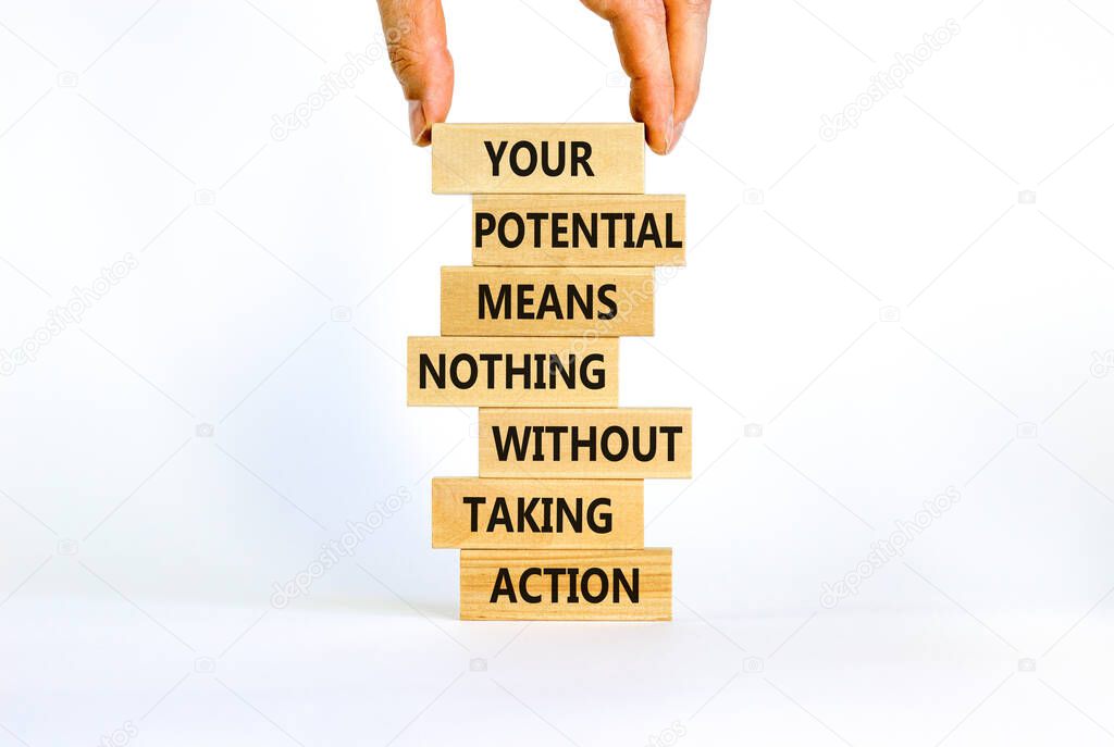 Potential in action symbol. Wooden blocks with words Your potential means nothing without taking action. Beautiful white background, copy space. Businessman hand. Business potential in action concept.