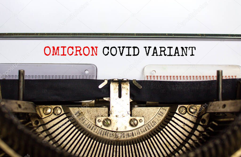 Covid-19 new omicron virus variant symbol. Concept words Omicron covid variant typed on retro typewriter. Medical and COVID-19 pandemic new omicron variant strain mutation concept.