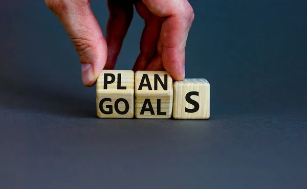 Plans Goals Symbol Businessman Turns Wooden Cubes Changes Word Goals — Stockfoto