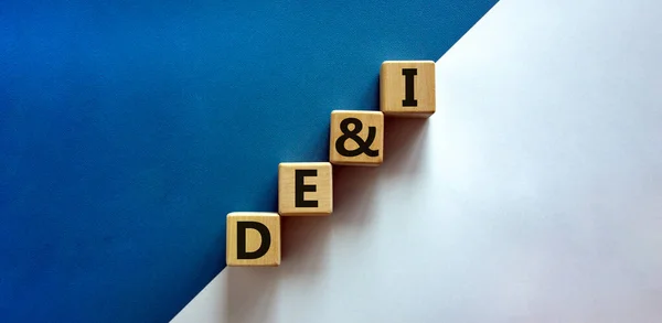 DEI, Diversity, equity and inclusion symbol. Concept words DEI, diversity, equity and inclusion on wooden cubes on beautiful white background. Business, DEI, diversity, equity and inclusion concept.