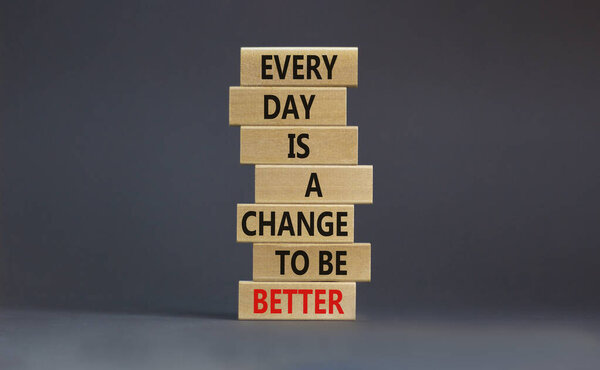 Change to be better symbol. Wooden blocks with words Every day is a change to be better. Beautiful grey table, grey background, copy space. Business, motivational change to be better concept.