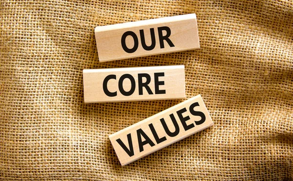 Our core values symbol. Concept words Our core values on wooden blocks on a beautiful canvas table canvas background. Business value and our core values concept. Copy space.