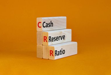 CRR nakit rezerv oranı sembolü. Turuncu bir arka planda, bloklardaki CRR nakit rezervi oranı kavramsal kelimeler. İş ve CRR nakit rezerv oranı kavramı. Boşluğu kopyala.