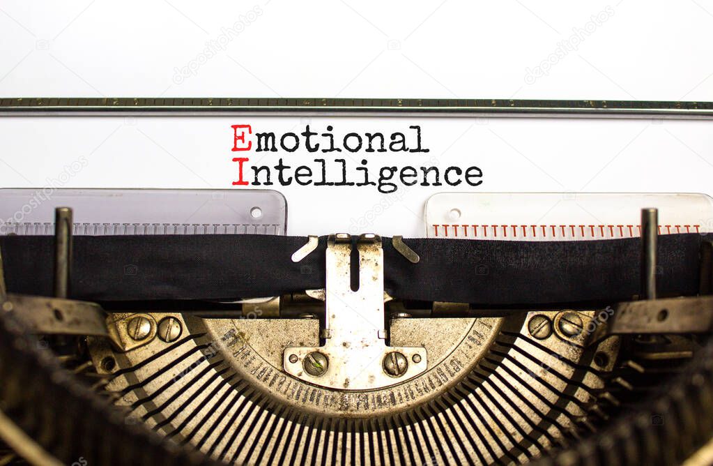 EI emotional intelligence symbol. Concept words EI emotional intelligence on white paper typed on retro typewriter. Beautiful background. Business EI emotional intelligence concept, copy space.