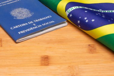 LAURO DE FREITAS, BRASIL - JULY 21, 2022 : brazilian work document with a brazilian flag