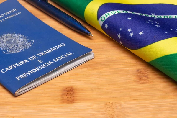 LAURO DE FREITAS, BRASIL - JULY 21, 2022 : brazilian work document with a brazilian flag