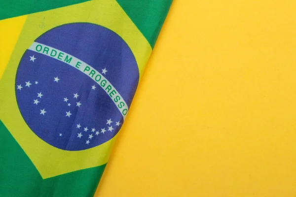 Brazilian Flag Yellow Background — Fotografie, imagine de stoc