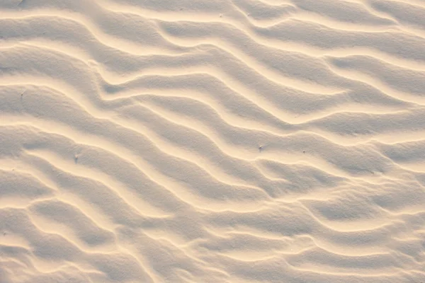Sandbeige Textur Einem Sonnigen Tag Textur lizenzfreie Stockbilder
