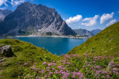 dam wall at the blue green lake Luenersee in Vorarlberg, Austria