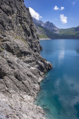 dam wall at the blue green lake Luenersee in Vorarlberg, Austria