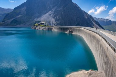 dam wall at the blue green lake Luenersee in Vorarlberg, Austria