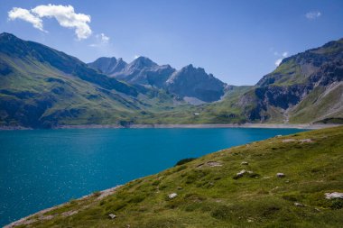 Aerial shot of the Luenersee with dam wall and rocks in Vorarlberg, Austria