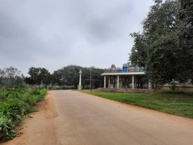 Bangalore, Karnataka, India-Dec 15, 2021: Closeup of beautiful asphalt and sand road in a rural with nature background